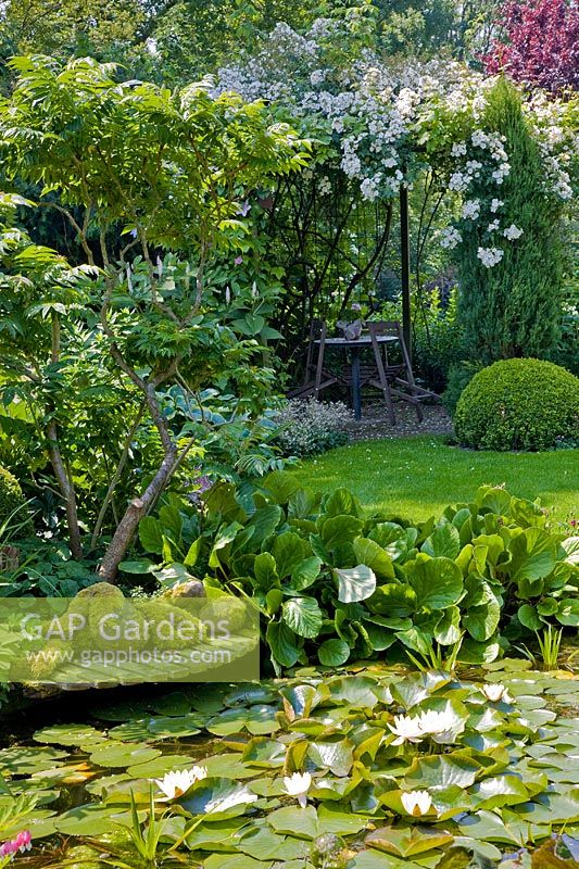 Garden pond with reclining sculpture