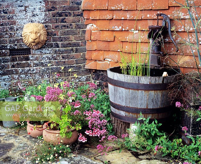 Water feature and pots, hand pump in barrel