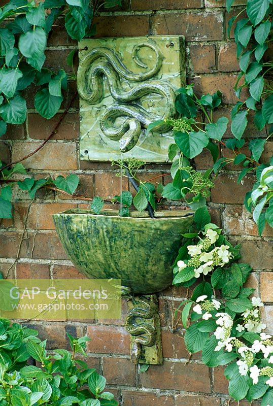 Water feature - wall mounted ceramic snake fountain with matching bowl and bracket