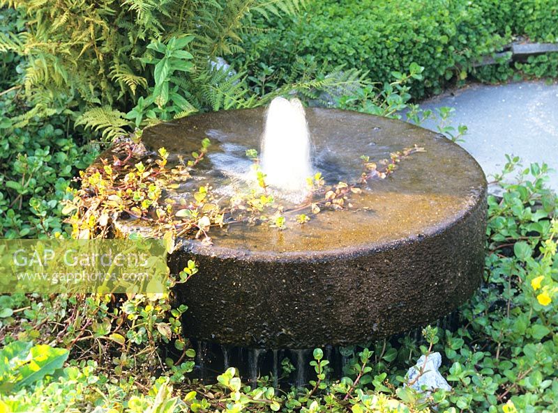 Old mill stone water fountain 