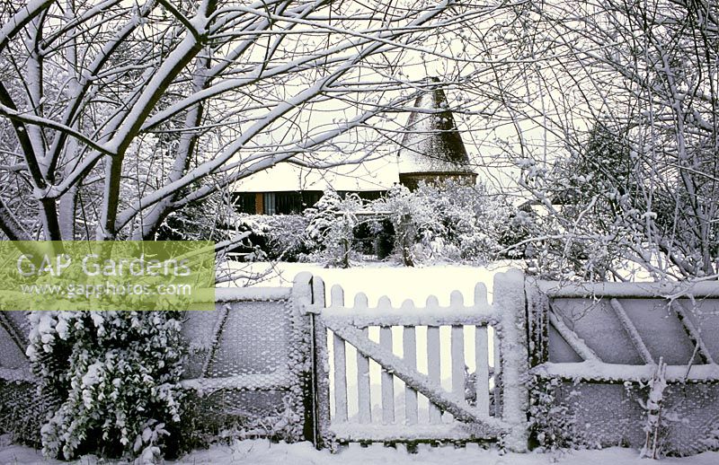 The Oast Houses, Hampshire - View through garden gate in snow