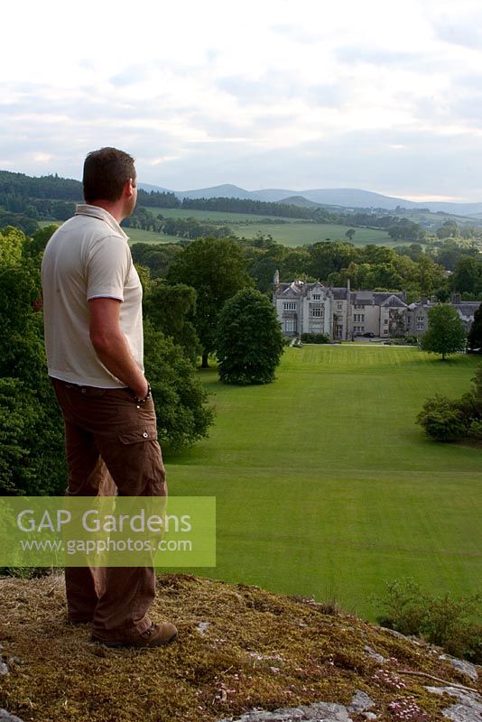 Man looking at house and lawns of Kilruddery Garden in County Wicklow