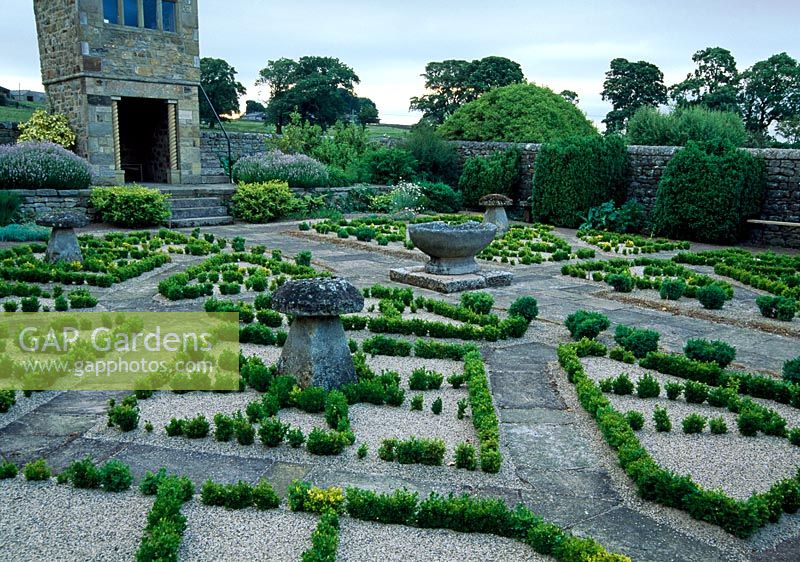 Gazebo in the fancy garden, begun in 1996, laid out with Buxus plants in arrangement derived from the Tudor rose pattern - Herterton House, nr Cambo, Morpeth, Northumberland