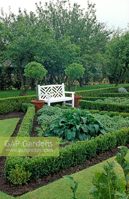Formal Potager with painted white seat