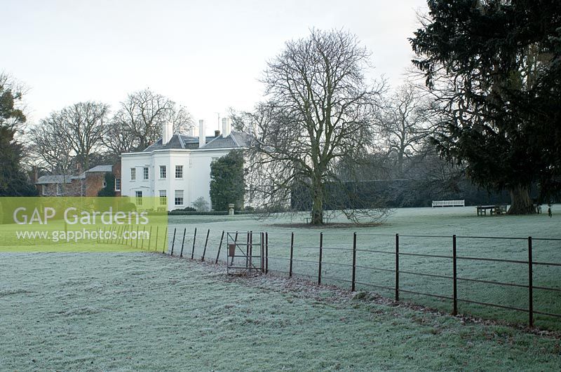 Frosty winter garden with large house set in parkland - Spencers, Great Yeldham, Essex