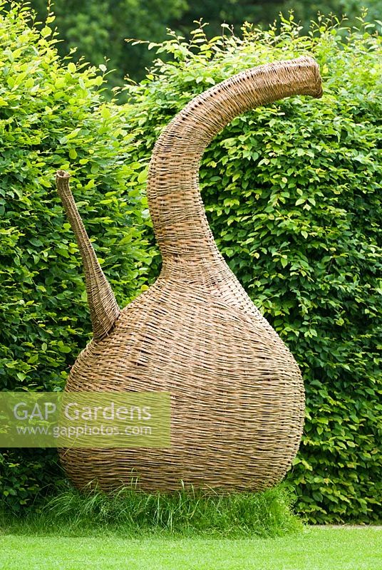 Woven willow sculpture representing an inverted root system - RHS Gardens Wisley