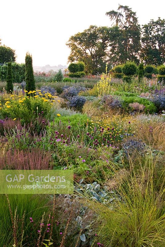 Mixed perennials and grasses within the walled garden at Broughton Grange