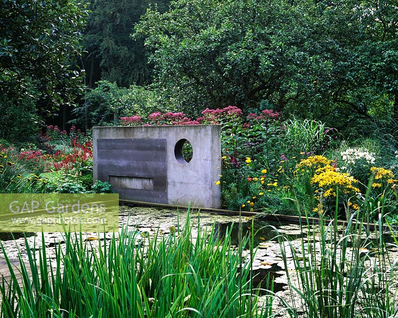 Concrete sculpture over lily pond - Greystone Cottage, Oxfordshire