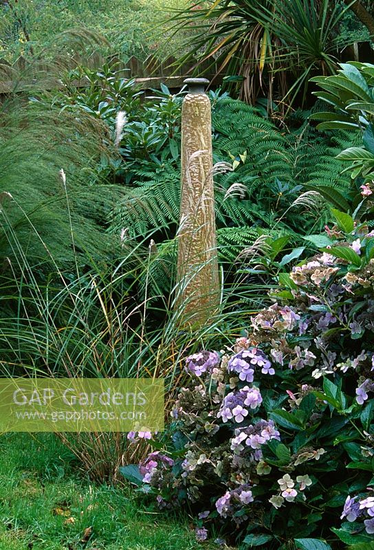 Elongated pot sculpture in Hydrangea, grasses and fern border - Lakemount, Ireland
