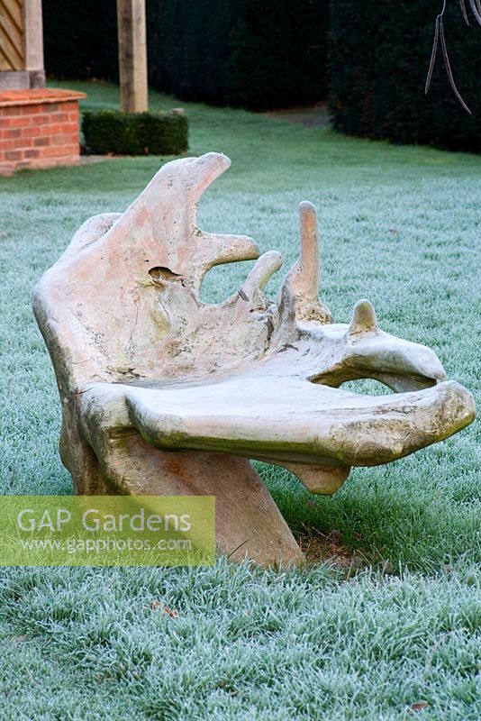 Sculpted wooden bench on frosty lawn - Woodpeckers, Warwickshire