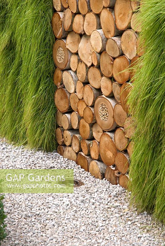 Log Stacked Wall - The Porsche Garden - RHS Hampton Court Flower Show 2008