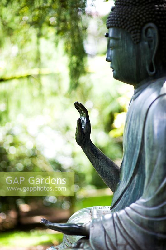 Garden Buddha statue at Batsford Arboretum