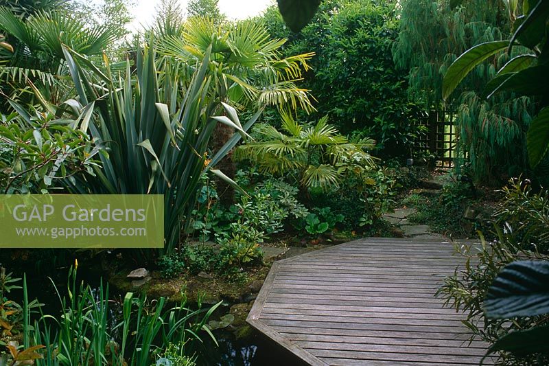 Large tropical garden with decked platform - The Hockett, Marlow, UK