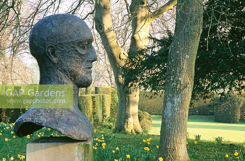 'Im Memoriam III' 1983, bronze head on plinth by Dame Elizabeth Frink - Cranborne Manor Garden, Cranborne, Dorset
