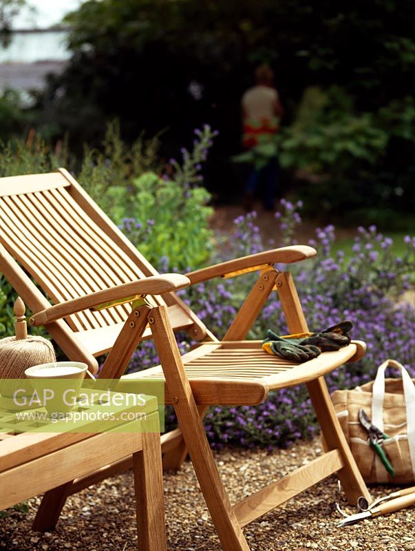 Wooden chair and table in garden