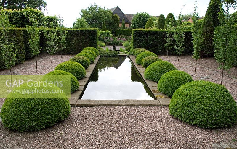 Topiary in the rill garden at Wollerton Old Hall, Shropshire