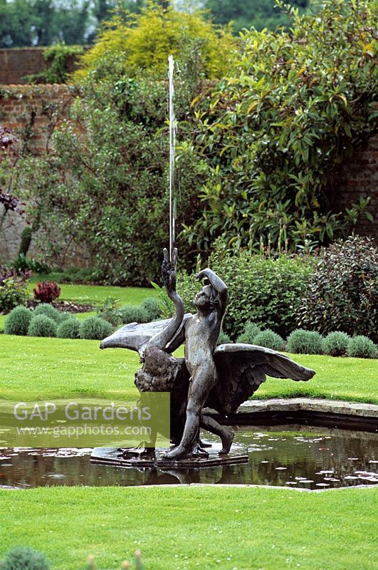 Fountain with lead statue of boy and swan