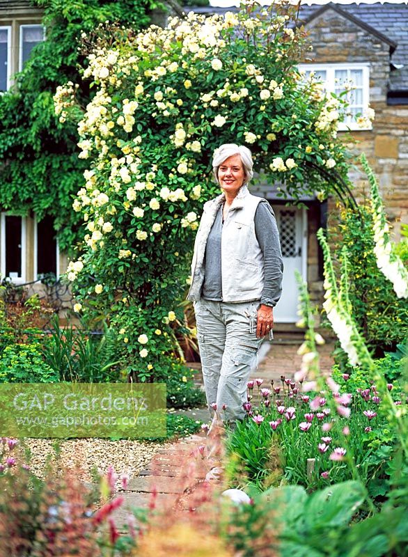 Woman in cottage garden