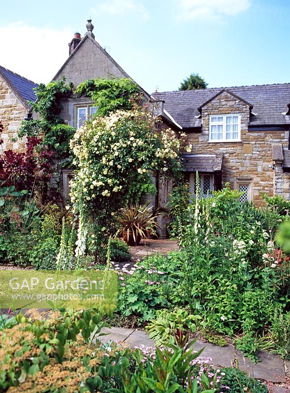 Cottage garden with mixed flowerbeds