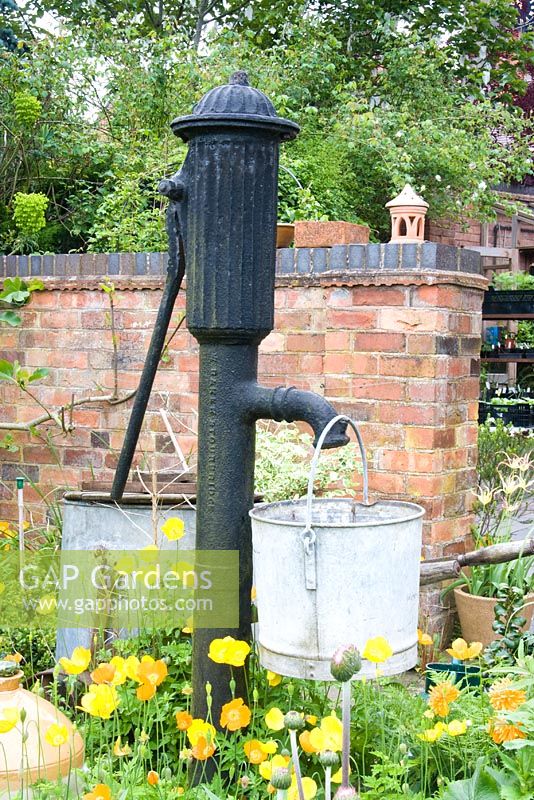 Old fashioned water pump in the garden at Dial Park, Worcestershire.