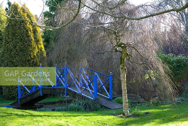 Blue painted bridge across pond - Sherborne Garden, Litton, Somerset 