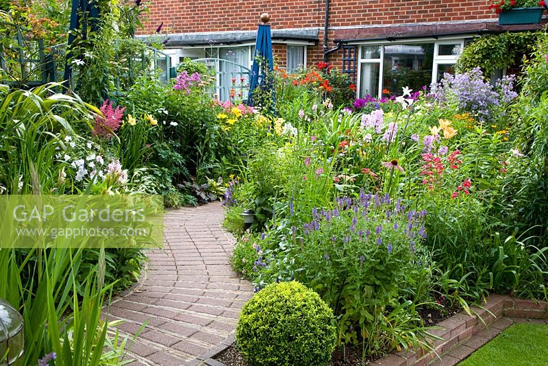 Small front garden with brick path