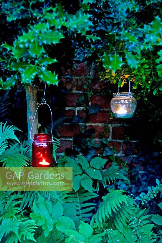 Hanging glass jars with tealights 