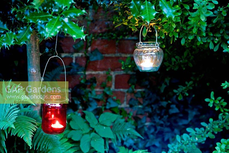Hanging glass jars with tealights 
