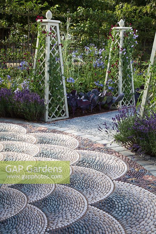 Detail of the decorative pebble paving in 'A Beekeeper's Garden' at RHS Hampton Court Flower Show 2009