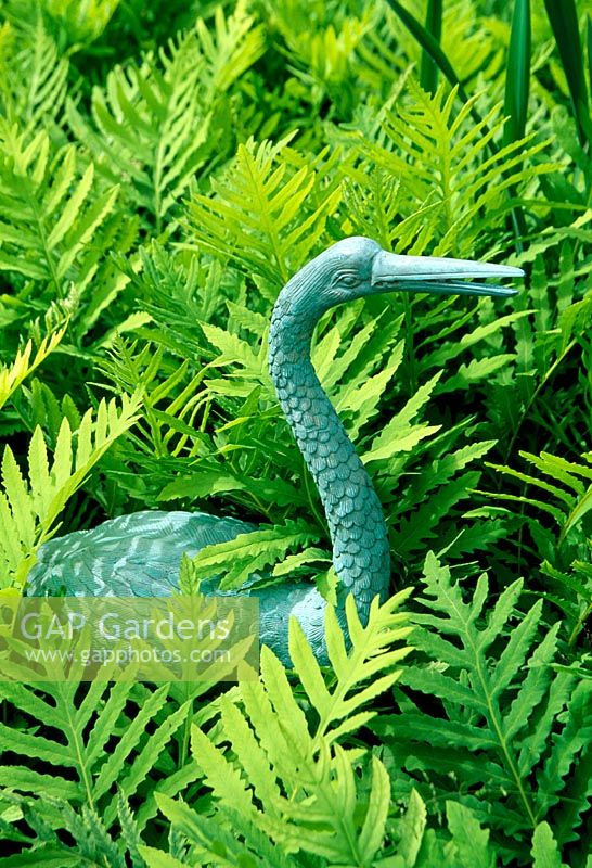 Bronze statue of bird in the bog garden - Llanllyr Garden, Talsan, Ceredigion, Wales