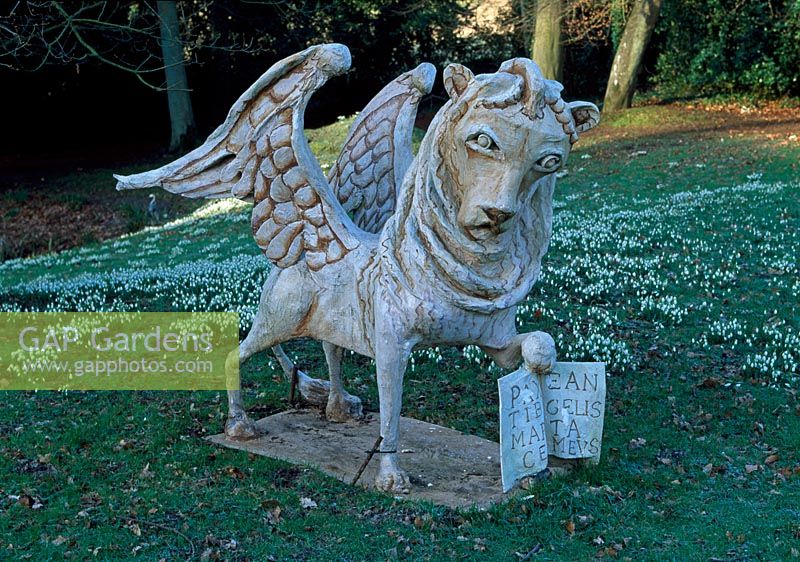 Griffin on the Bowling Green with snowdrops behind - Painswick Rococo Garden, Painswick, Gloucestershire in February