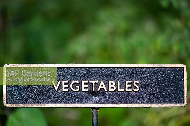 Metal vegetable sign in a garden
