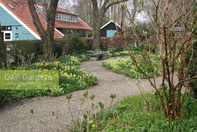 Gravel paths with Spring borders - The Teagarden is a combination of model garden, garden shop and tearoom in Weesp, Holland. 