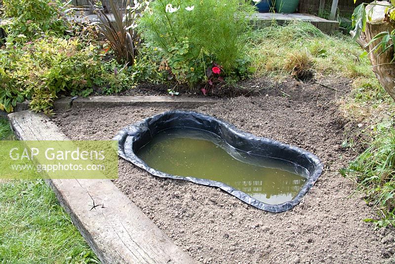 Garden pond project - step by step - moulded lining filled with water