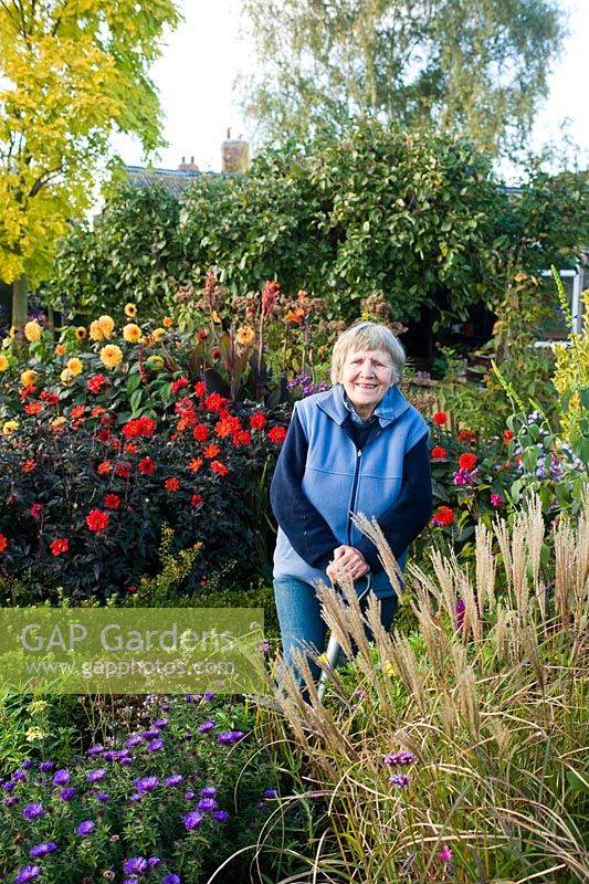 Joan Curtis working in her garden