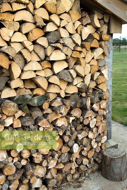 Firewood in dry storage ready for winter fuel