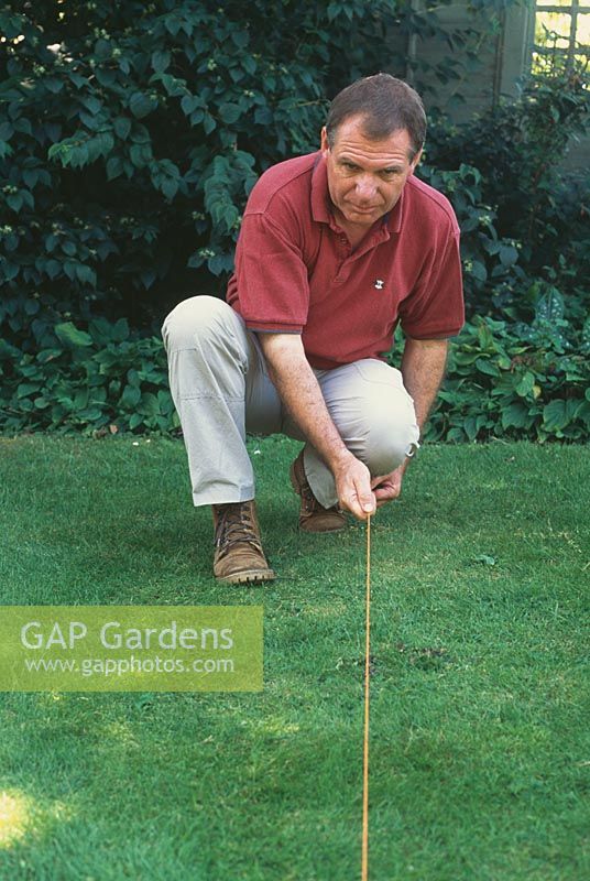 Step by step guide to measuring up a garden. Mark out a straight line along the length of the garden using a piece of string and two canes. Use this as a firm guide when taking all of your measurements.