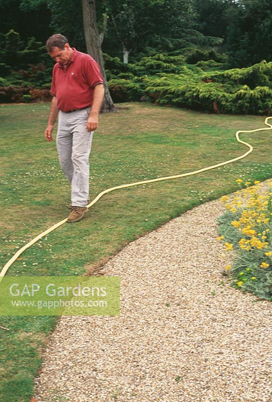 How to mark out your plot. A brightly coloured hosepipe is ideal for using as a guide to mark the boundary of a bed or border, or to mark the edges and route of a new path.