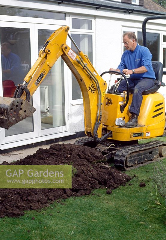 Laying a path - Removing soil with digger