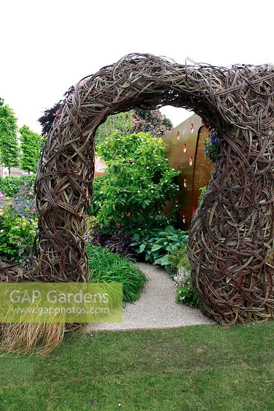 Salix archway in the John Joseph Mechi Garden, sponsored by Wilkin and Sons - Bronze medal winner at RHS Chelsea Flower Show 2010
