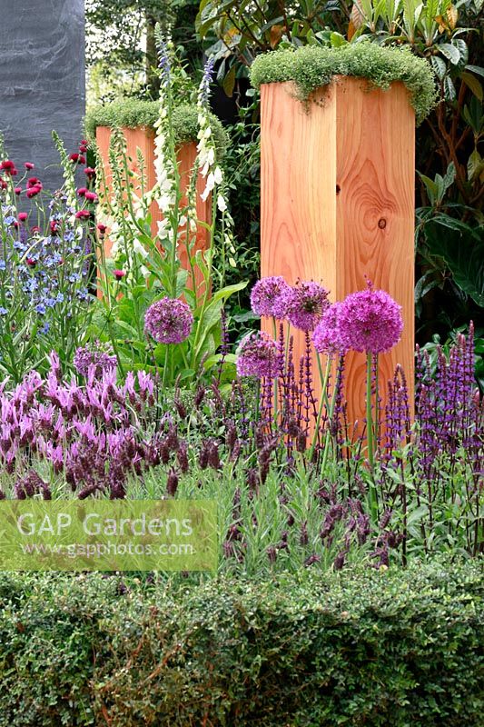 Raised wooden honeycomb planters - Global Stone Bee Friendly Plants Garden, Silver medal winner at RHS Chelsea Flower Show 2010 
