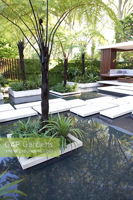 Pond with planting in rectangular beds. The Tourism Malaysia Garden, Gold medal winner, RHS Chelsea Flower Show 2010 
 