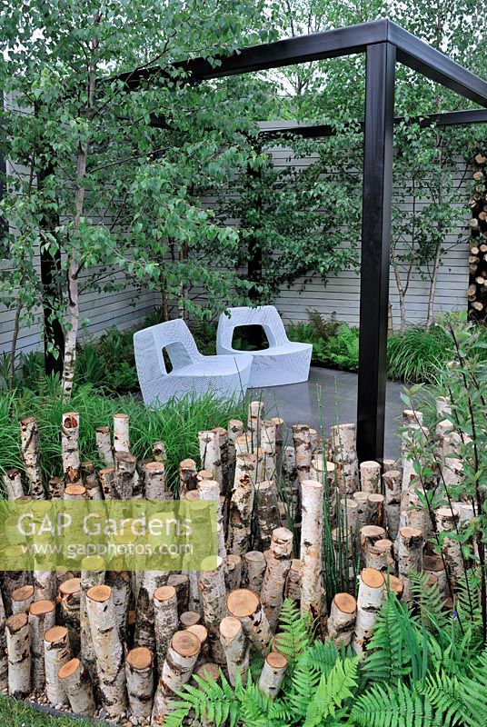 Stumpery in Urban garden. . The Naturally Fashionable Garden, Silver Medal winner, RHS Chelsea Flower Show 2010
 