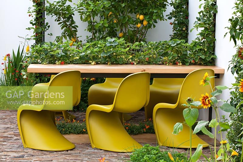 A table and seating area. 'Food 4 Thought' - Gold Medal Winner - RHS Hampton Court Flower Show 2010 