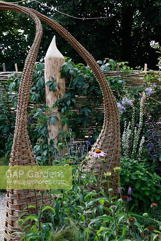 Willow structures in borders. 'It's Only Natural' - Silver Gilt Medal Winner - RHS Hampton Court Flower Show 2010 
 