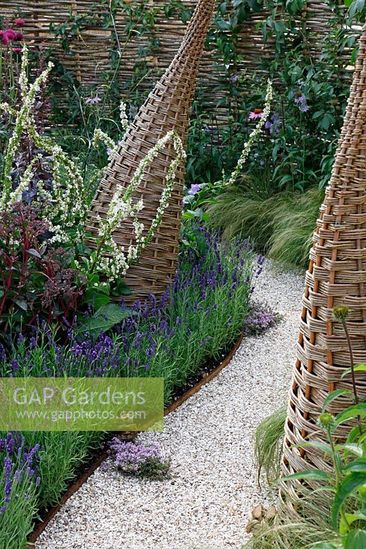 Willow structures and shell path in wildlife garden. 'It's Only Natural' - Silver Gilt Medal Winner - RHS Hampton Court Flower Show 2010 