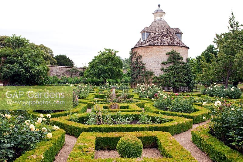 The Pigeon House Garden with Box hedges and roses - Rousham Park House and Garden, Bicester, Oxfordshire, designed by William Kent 1685-1748