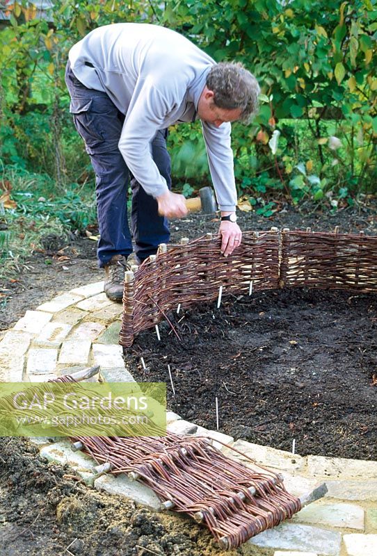Mini potager - Step 6. Use short woven panels to form a low edging along the brick path