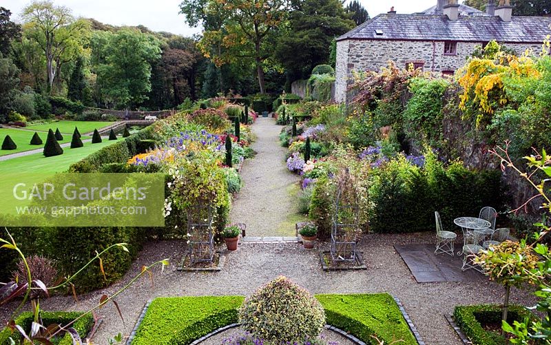 View from the upstairs window of the Garden Cottage of The Double border and the Walled Garden - Plas Cadnant, Menai Bridge, Anglesey, Wales