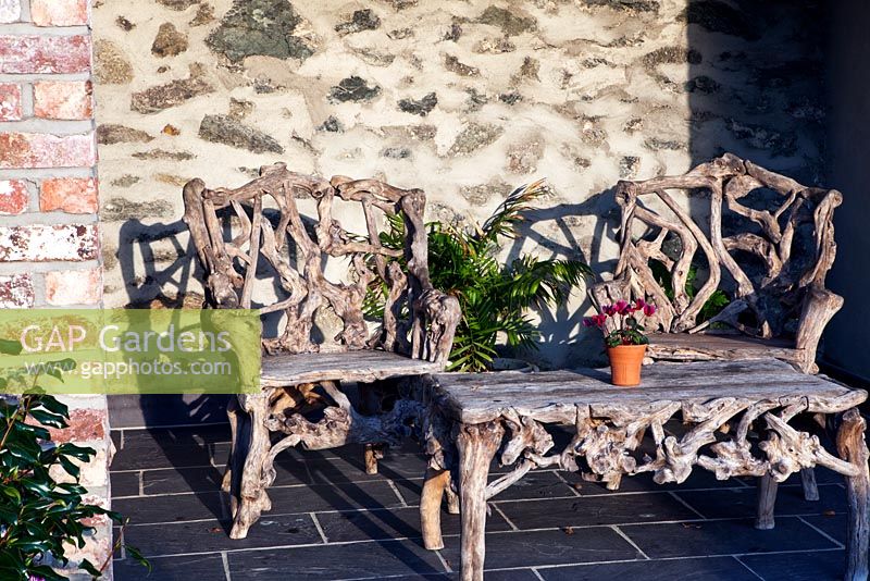 Rustic seats and table outside the Garden cottage - Plas Cadnant, Menai Bridge, Anglesey, Wales